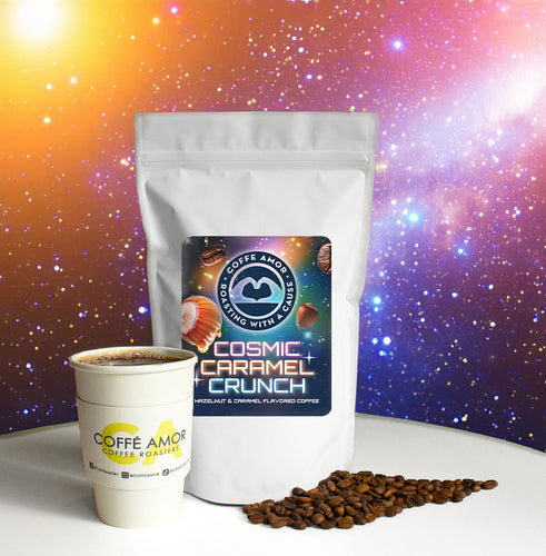 A bag of Cosmic Caramel Crunch flavored coffee with a space background and a cup of coffee in front along with a pile of coffee beans