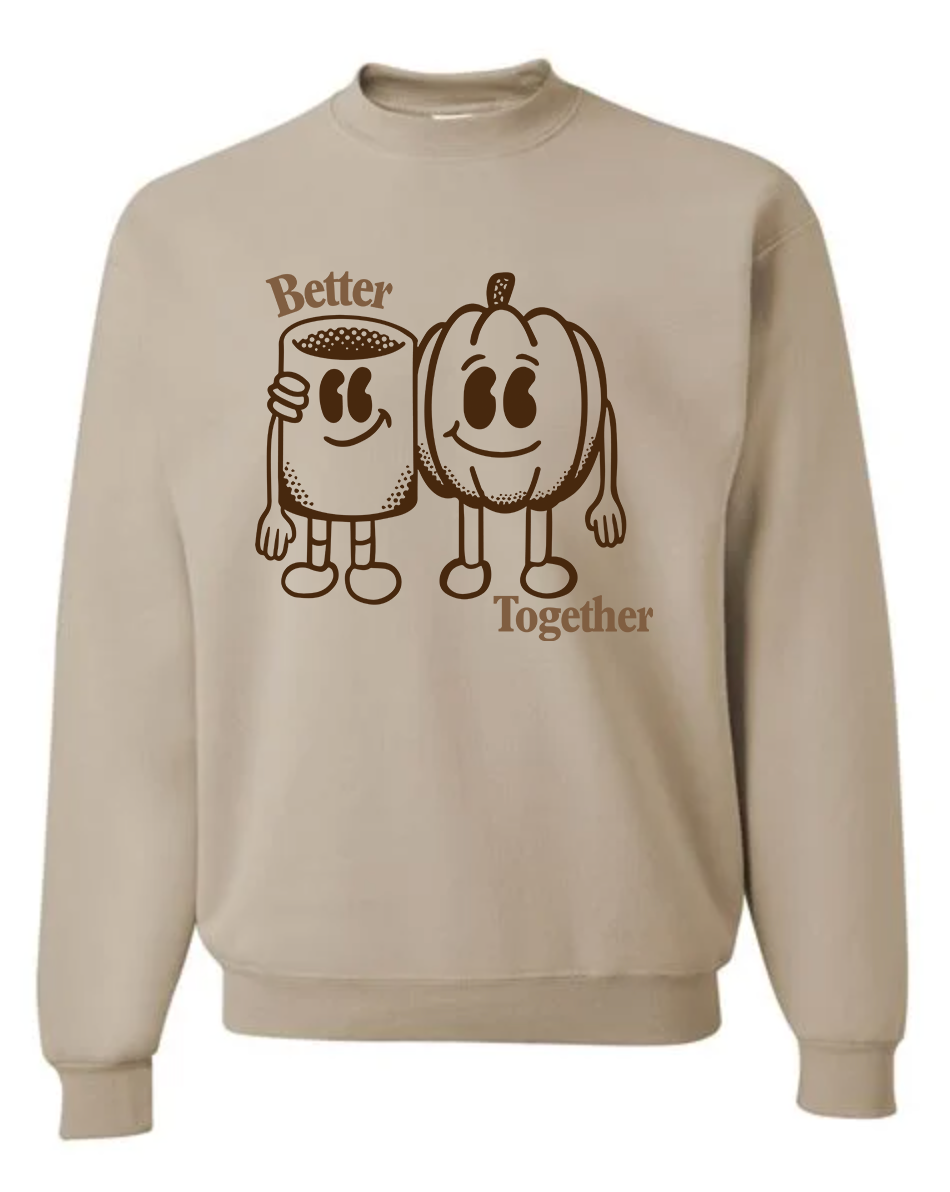A beige crewneck sweatshirt featuring a brown graphic of a coffee mug and a pumpkin character with the words 'Better Together' printed on the front.
